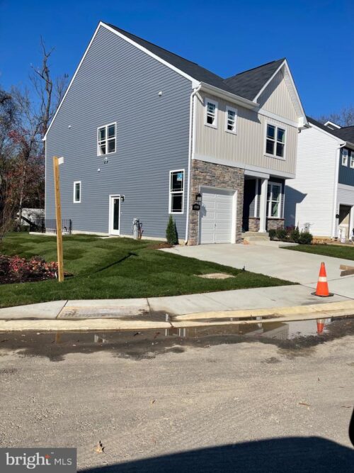 side view of house with sidewalk